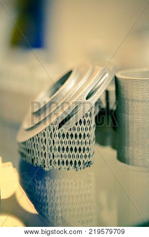Object printed on metal 3d printer. A model created in a laser sintering machine close-up. DMLS, SLM, SLS technology. Concept of 4.0 industrial revolution. Progressive modern additive technology.