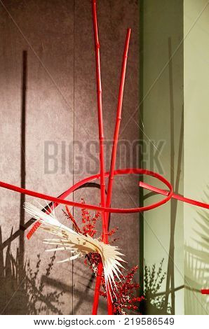 ikebana traditional Japanese art layout of cut flowers and sprouts in special containers