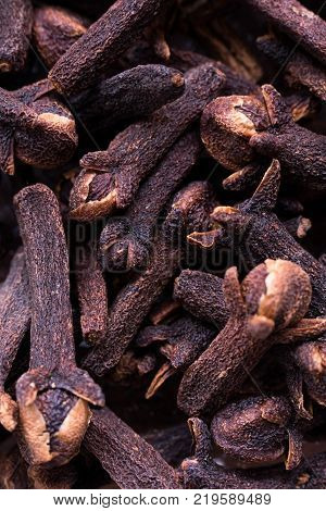 A macro photo of clove showing detailed structure of the dried flower buds. Clove is used as a spice and herbal medicine.