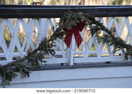 outdoor white bridge with Christmas grennery decoration
