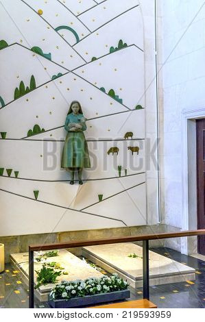 Lucia Jacinta Tombs Graves Basilica of Lady of Rosary Fatima Portugal. Church created on site where Jacinta and Lucia ,Portuguese Shepherd children, saw Virgin Mary of the Rosary. Basilica created in 1953.