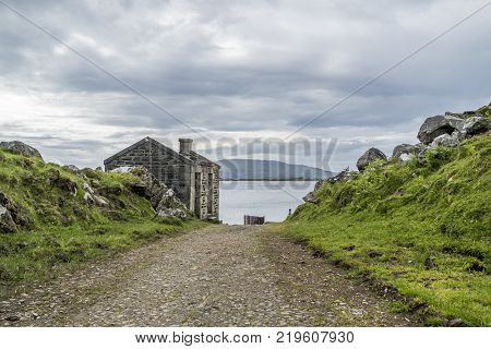 The rotten pier at Craignish point with the Sound of Jura in the background, Scotland
