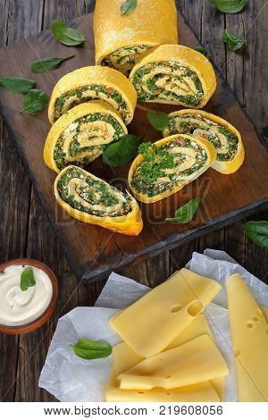 Egg And Cheese Roulade With Spinach And Feta