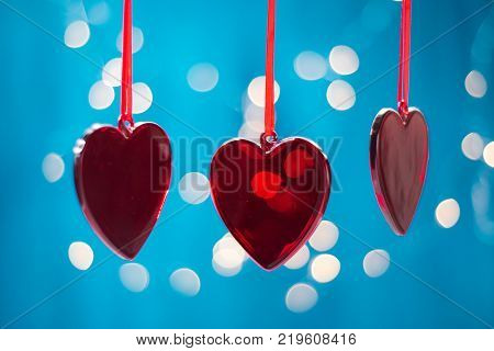 Two red hearts of ribbon. Valentines day greeting card.