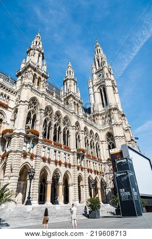 Vienna,  Austria - August 16, 2017: Rathaus building in Vienna. It is the the town hall of the city. Low angle view against blue sky
