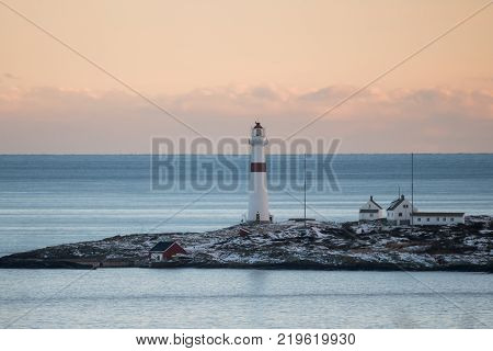 Sea view to the Torungen lighthouse a cold colorful winter evening