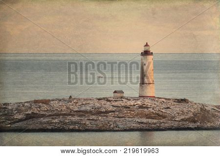 Sea view to the small Torungen lighthouse a cold colorful winter evening