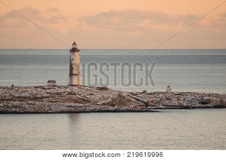 Sea view to the small Torungen lighthouse a cold colorful winter evening