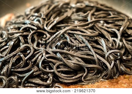 black pasta squid ink closeup italian taglierini al nero di seppia.
