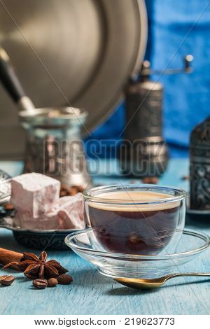 Turkish coffee and turkish delight with traditional embossed metal tray and cup