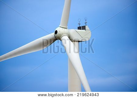 Wind power stations.
Wind power is the use of air flow through wind turbines to mechanically power generators for electric power. A wind farm is a group of wind turbines in the same location used for production of electric power.