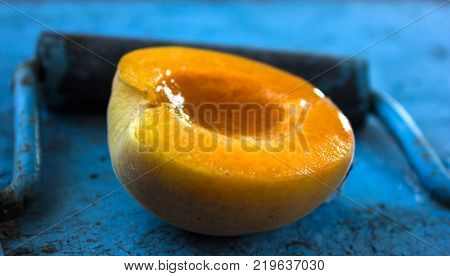 Ripe Sweet Apricots On A Wooden Background. Ripe Sweet Apricots On A Wooden Background. Half Of Apri