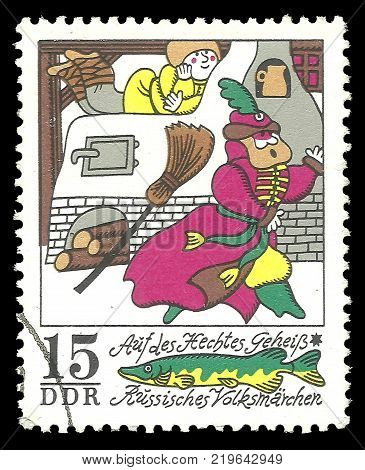 Germany - circa 1973: Stamp printed by GDR Color edition on Russian Winter Fairy Tales shows On the pike behest to ride on the stove circa 1973