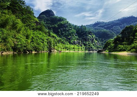 Rock formations lining the nine bend river or Jiuxi in Wuyishan or Mount wuyi scenic area in Wuyi China in fujian province