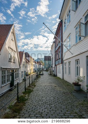 Narrow cobbestone Ytre Markeveien Street in the old town of Bergen in Norway