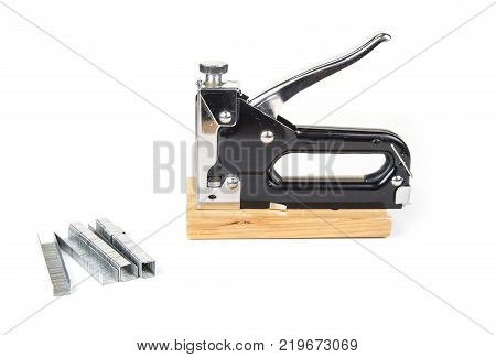 Heavy duty staple gun with staples on the white background