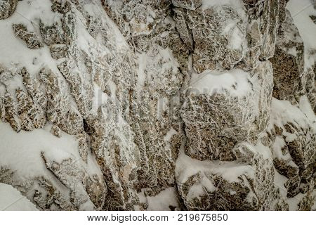 Icy rocks in the Swiss Alps. Taken during a snow storm nearby the 