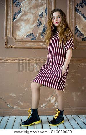A portrait of a teen girl model in a stdio