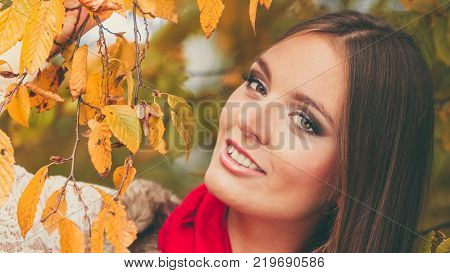 Fall lifestyle concept harmony freedom. Attractive young woman fashion girl long hair relaxing walking in autumnal park outdoor