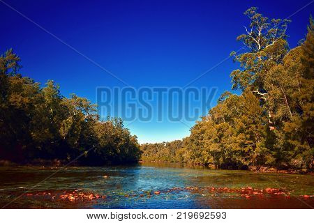 A landscape of a sun burned Australian river