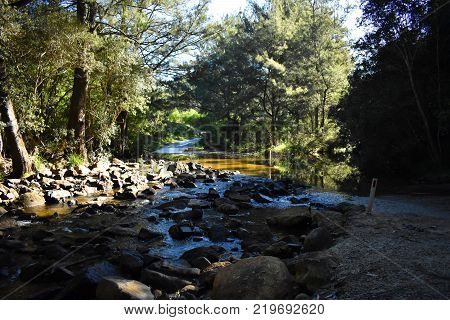 A rocky waterfall along a river crossing