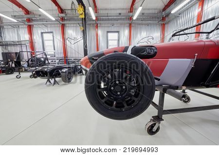 MOSCOW, RUSSIA - OCT 27, 2017: (PR) Racing cars based on Lotus Seven on racks in garage of DB 527 company producer of russian sports cars.