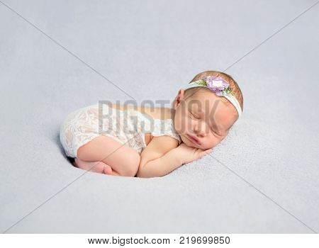 Adorable newborn baby in bodysuit