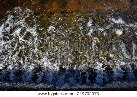 A small waterfall off the side of a water crossing