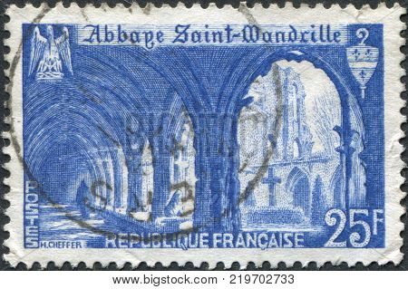 FRANCE - CIRCA 1949: A stamp printed in France shows the Cloister of St. Wandrille Abbey circa 1949