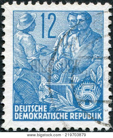 DDR - CIRCA 1953: A stamp printed in DDR shown Worker peasant and intellectual circa 1953