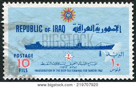 IRAQ - CIRCA 1965: A stamp printed in the Iraq is dedicated to ending the construction of a deepwater port at Basra. Depicts an oil tanker circa 1965