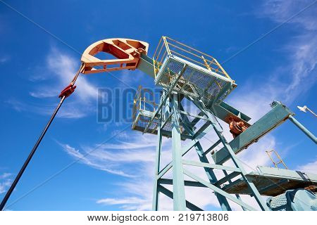 Pumpjack.
A pumpjack is the overground drive for a reciprocating piston pump in an oil well.
The arrangement is commonly used for onshore wells producing little oil. Pumpjacks are common in oil-rich areas.