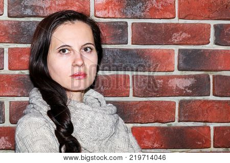 Portrait Of The Young Woman Up To Shoulders At A Wall