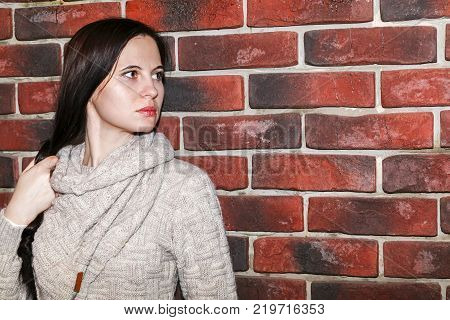Portrait Of The Young Woman Up To Shoulders At A Wall