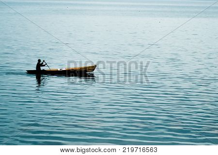 silhouette of fisherman's boats in the lake