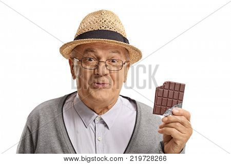 Happy mature man holding a bitten chocolate bar isolated on white background