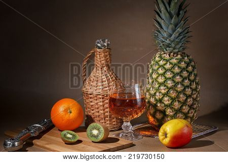 Tropical fruit and a jug on the table display.