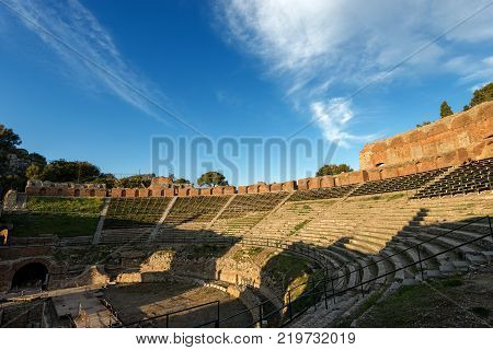 Ancient Greek Roman theater at sunset in Taormina town Messina Sicily island Italy (II century AD)