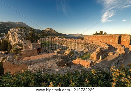 Ancient Greek Roman theater at sunset in Taormina town Messina Sicily island Italy (II century AD)