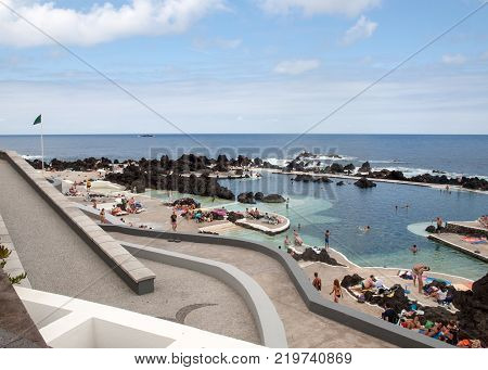 PORTO MONIZ MADEIRA PORTUGAL - SEPTEMBER 5 2016: Natural rock pool of Porto Moniz. It is a public bath with water from the Atlantic Ocean.