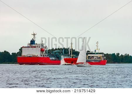 Red Cargo Ship At Riga