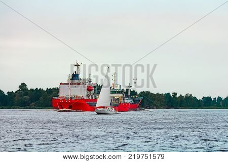 Red Cargo Ship At Riga