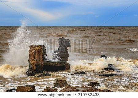 Waves beating against Latvia.Liepaja.Karosta. described the fortress ruins