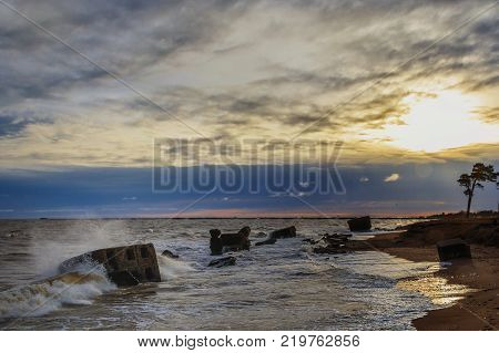 Waves beating against Latvia.Liepaja.Karosta. described the fortress ruins