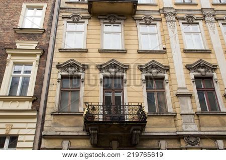 Facade of the old vintage house with a balcony