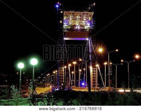 Bridge illuminated at night. The bridge in Salekhard