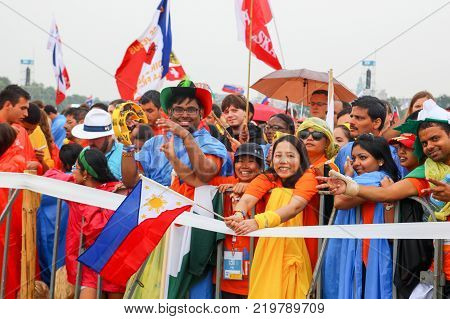 KRAKOW POLAND - 2016: Krakow Blonia World Youth Day 2016 young people from Asia greet Pope
