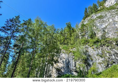 Tavda caves (tavdinskiye peshchery) - karst mountain massif with an extensive chain of caves landmark of Altai mountains Russia Siberia