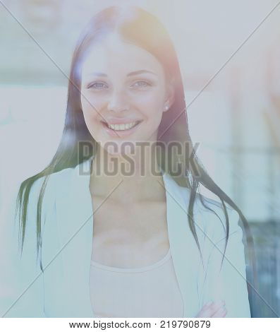 business woman looking thtough window in the office