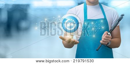 Employee shows the button service day night on blurred background.